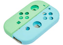 Protege tus controles Joy Con de Nintendo Switch con esta carcasa verde y azul en Xela Quetzaltenango.