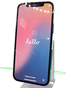 iPhone 12 Pro azul seminuevo, 128GB, con pantalla encendida mostrando la interfaz de iOS, salud de batería 100%.