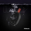 Parlante inalámbrico portátil Skullcandy Ounce XT negro, compacto y resistente, con asa para fácil transporte.