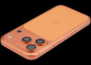 Tapa trasera usada iPhone 17 Pro Cosmic Orange con puerto de carga flex y pequeñas piezas internas.