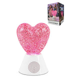 Lámpara LED rosa con purpurina, brillo suave y altavoz inalámbrico integrado. Perfecta para ambiente relajante.