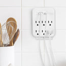 Cargador multipuerto Brookstone blanco con 6 puertos, incluyendo 1 USB-C y 1 USB-A, para carga rápida.