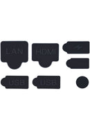 Set de 7 tapones antipolvo negros para puertos de la consola PS5, protegiéndola del polvo.