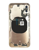 Tapa trasera de iPhone XS en color dorado con componentes pequeños preinstalados, sin logo, disponible en Xela.